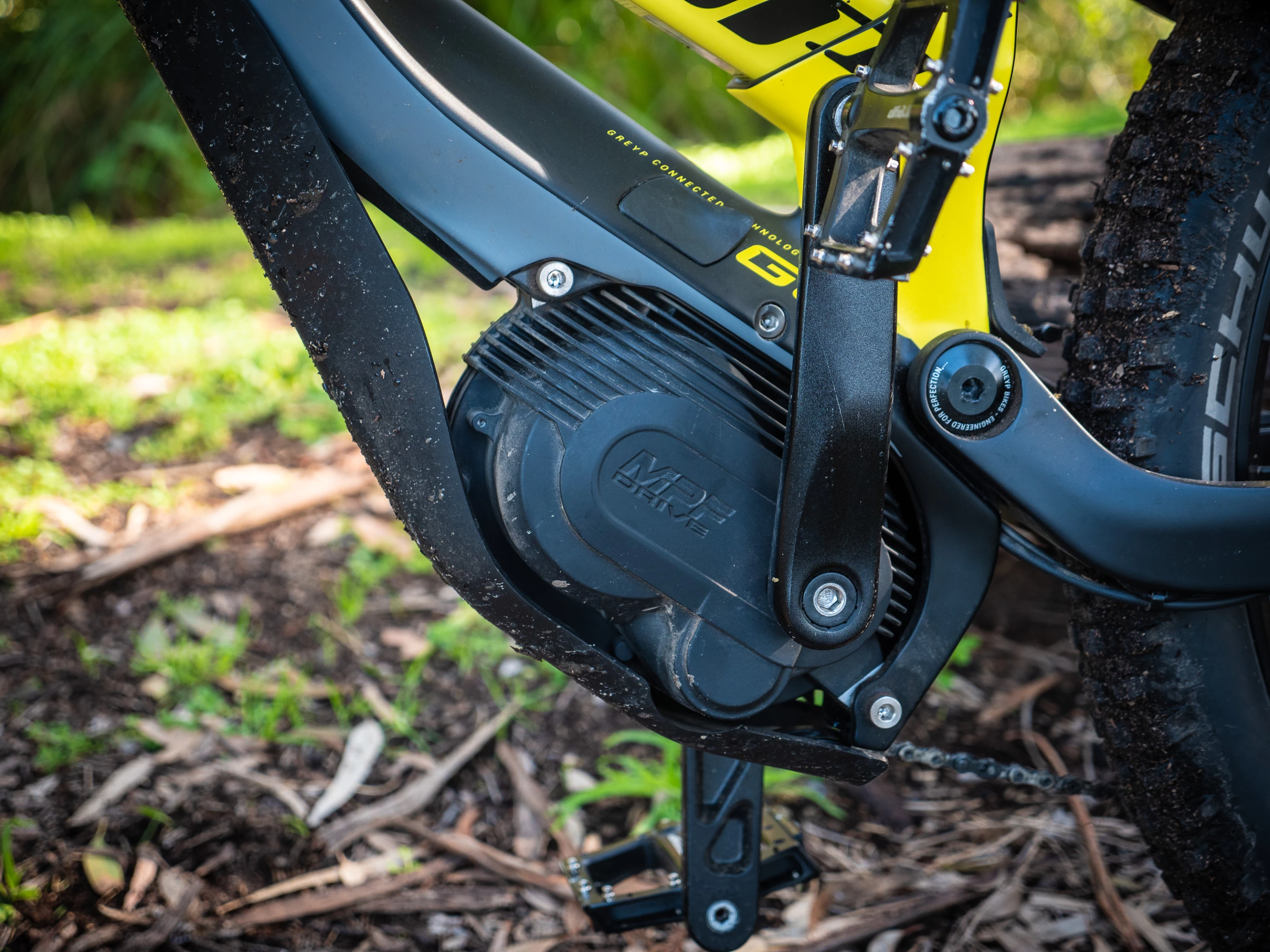 A plastic bashplate protects the motor from dings; this bike loves being thrashed off-road