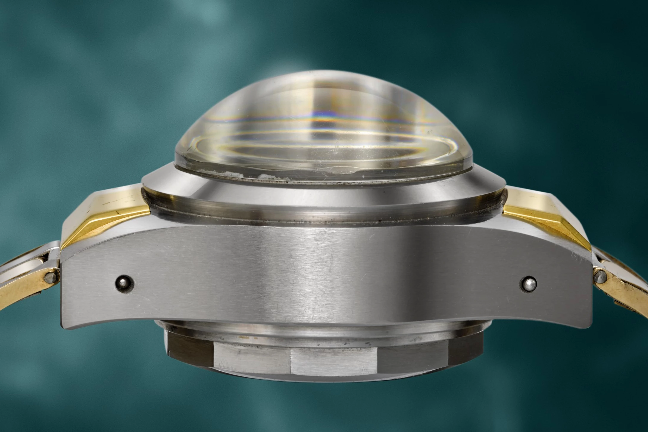 The muscular side profile of the 1953 Rolex Deep Sea Special №1 gives a hint of why it was able to submerge 10,915 metres (35,810 ft) and continue to work flawlessly. At that depth, it experienced a pressure of 1,150 atm or 1,150 kgs per cm2.