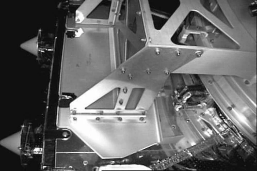 This is a view of one of the ARCSS sensor covers. The Advanced Video Guidance System sponsored by NASA's Marshall Space Flight Center is behind this sensor cover. This cover, which provides contamination protection during launch vehicle integration, launc