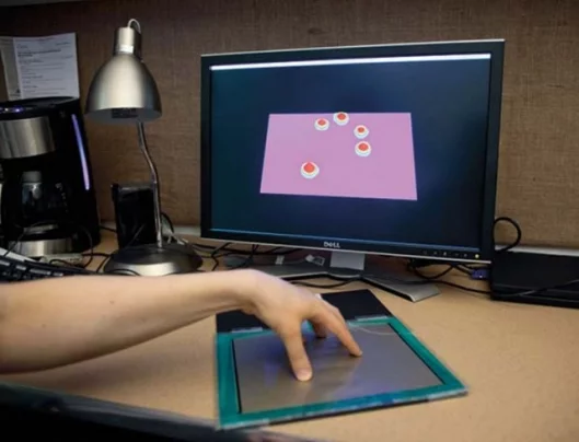 Software interprets the location and pressures exerted by the fingers