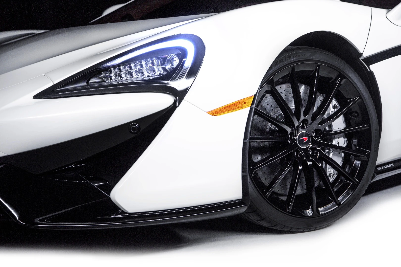 More gloss black exterior parts that highlight the pearl white exterior