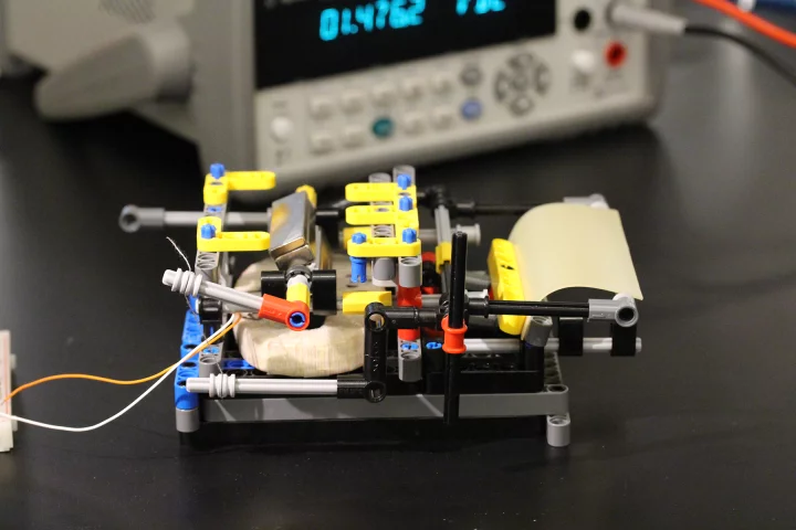 The humidity-driven flexing of a spore-covered piece of latex rubber (right) drives the movement of a magnet, which produces electricity (Photo: Xi Chen/Columbia University)