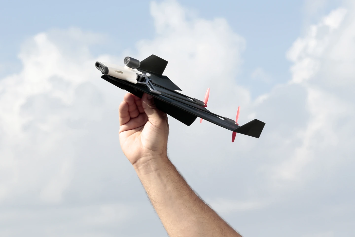 The PowerUp FPV consists of a front-located electronics module, a nylon/carbon fiber frame, and two props in the rear, all of which are attached to the top surface of a user-folded paper plane