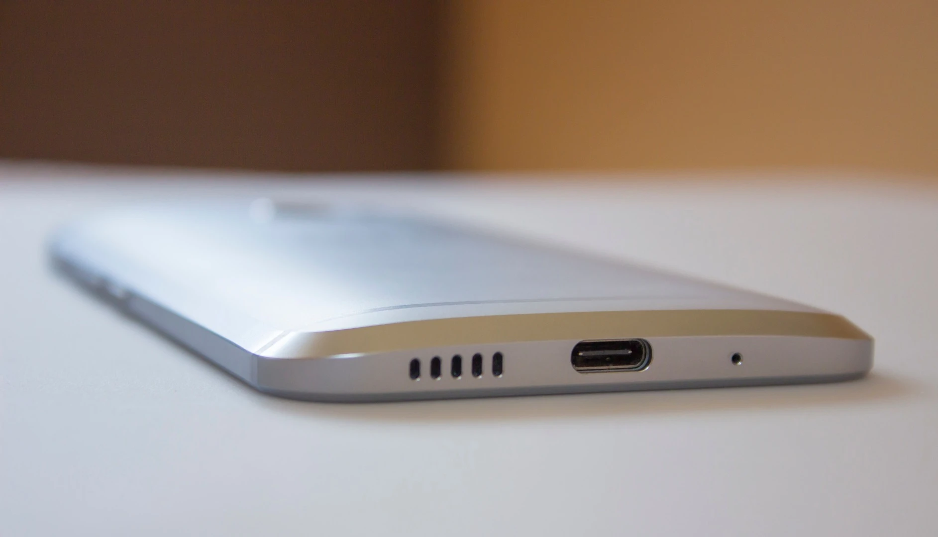 Its speakers move to the bottom edge (along with the ear speaker), with a USB-C port for charging