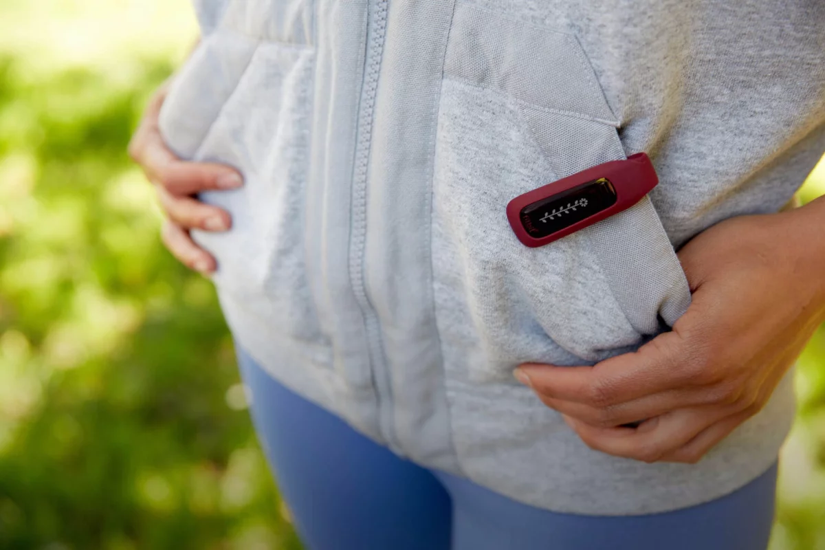 The Fitbit One being worn on a hoodie pocket – it can be clipped nearly anywhere: pockets, waistbands, belts, or bras