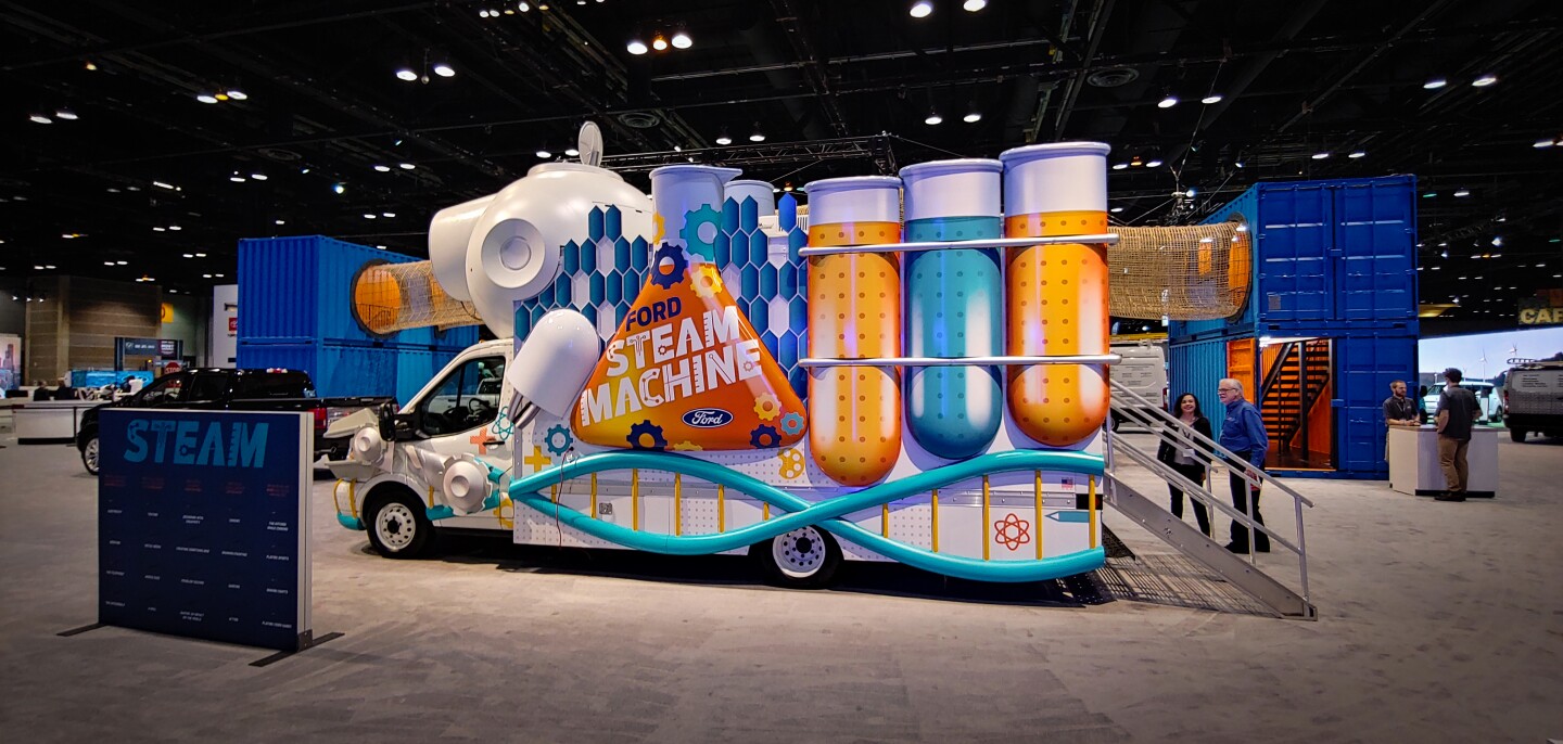 The outside of this Ford Transit STEAM Machine attracts kids with movement and color. Inside there are science, technology, engineering, arts, and math projects to play with hands-on