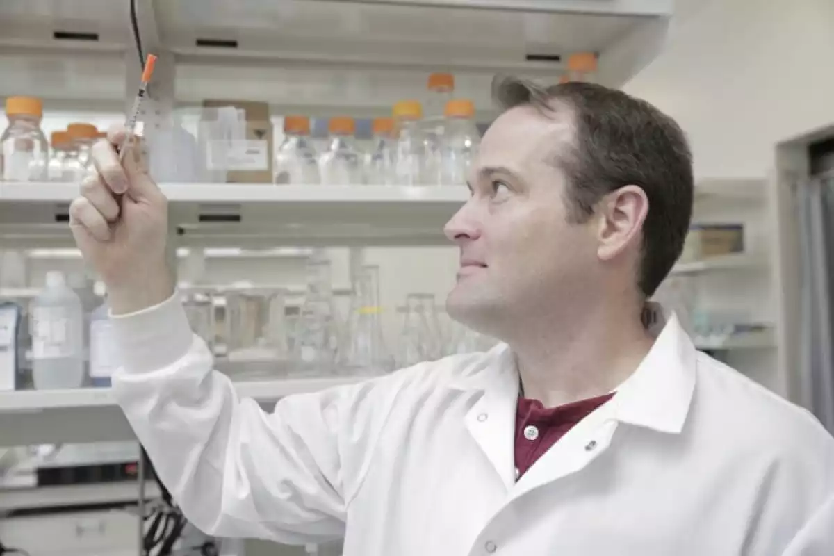 Assoc. Prof. Kip Ludwig, with a syringe of the injectrode material