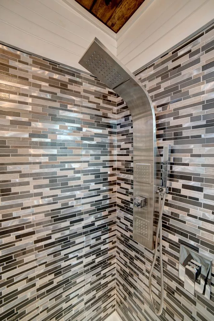 The bathroom includes a shower, toilet, and sink