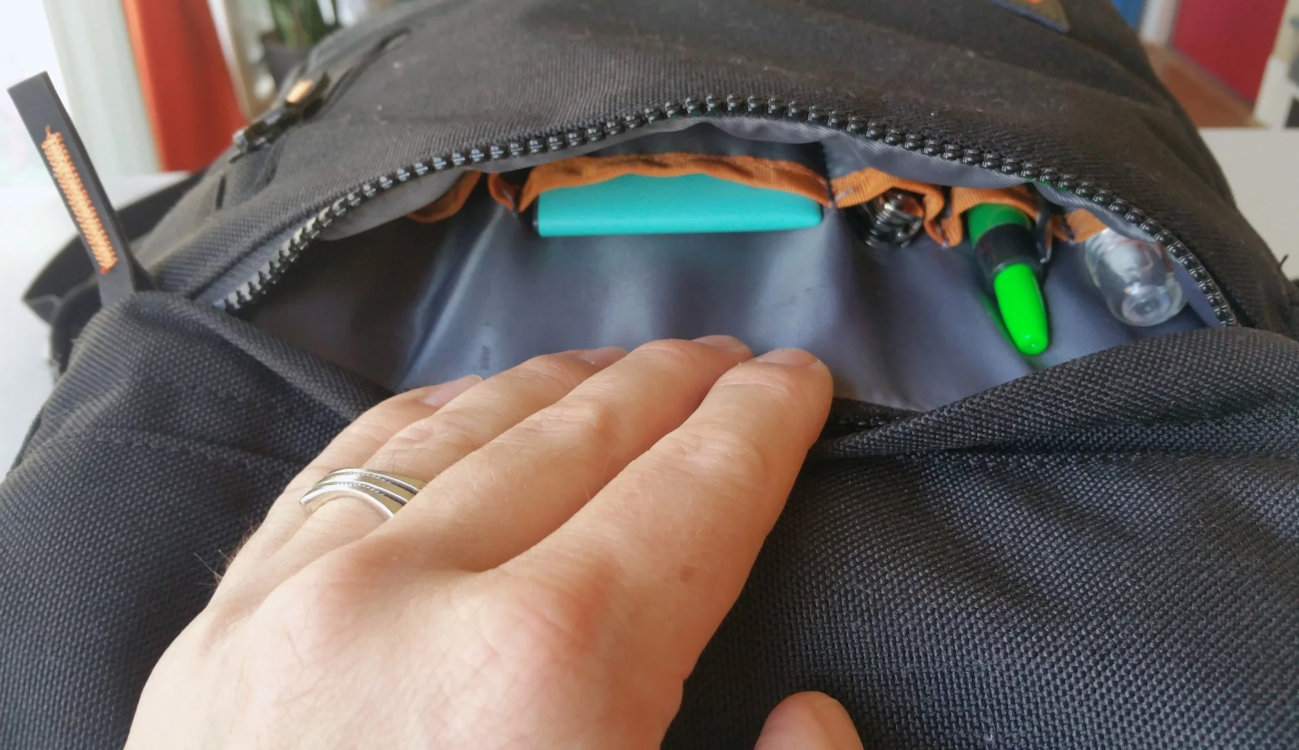 The MOS Pack's outside (horizontal) zipper pocket has the right amount of room for quick-grab and slim gear