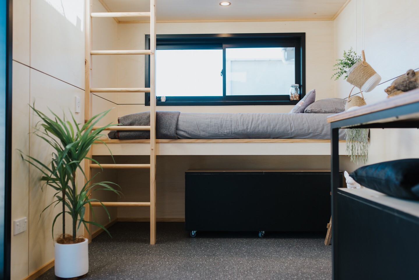 The Tiny Tāwharau includes a bunk bed sleeping area for the family's two young kids