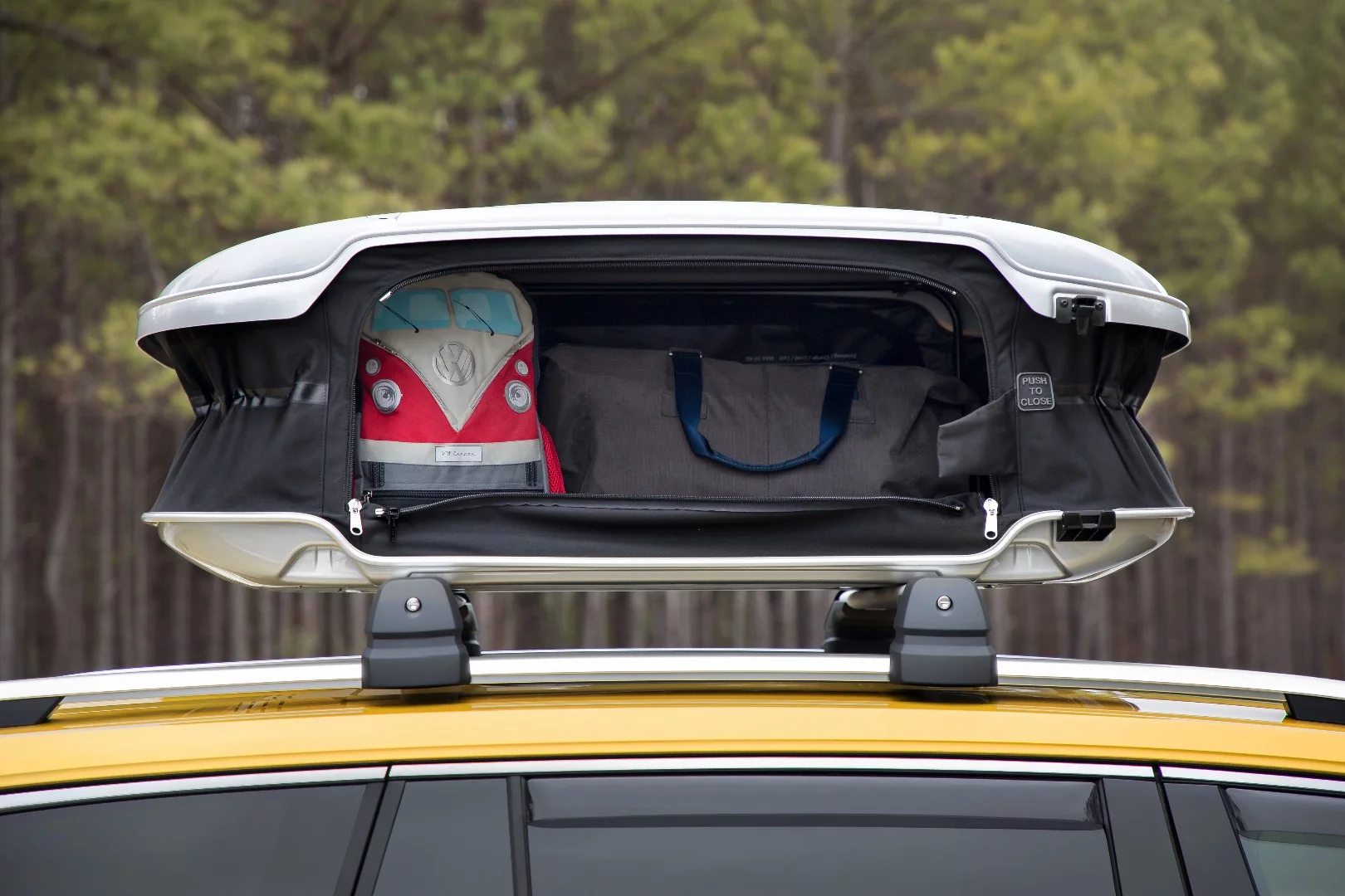 VW has a little fun with the Weekend Edition's camper-bus inspiration, loading up the "pop-up roof"with a Transporter-style backpack