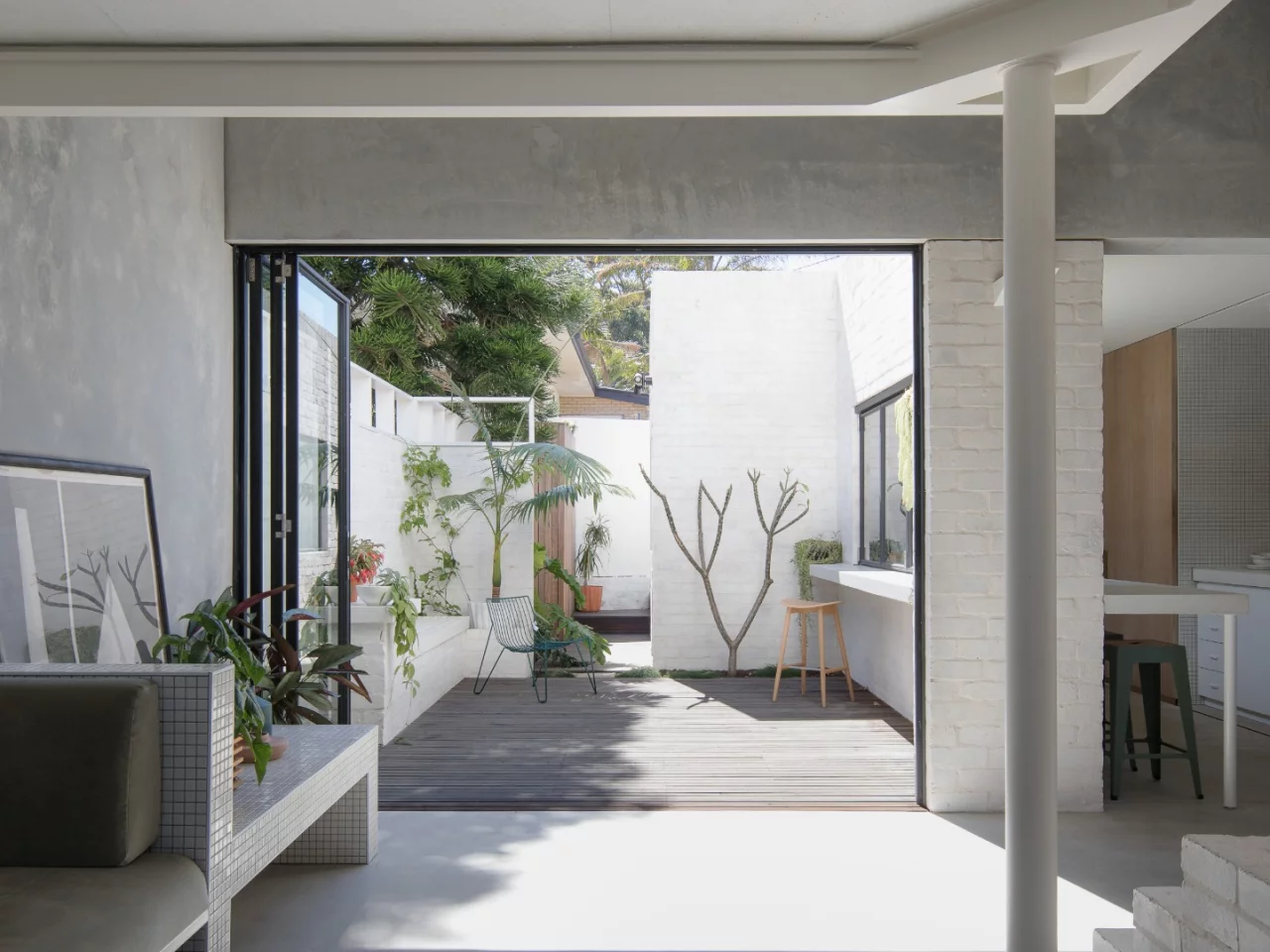 Large glass folding doors opne up onto the outdoor terrace