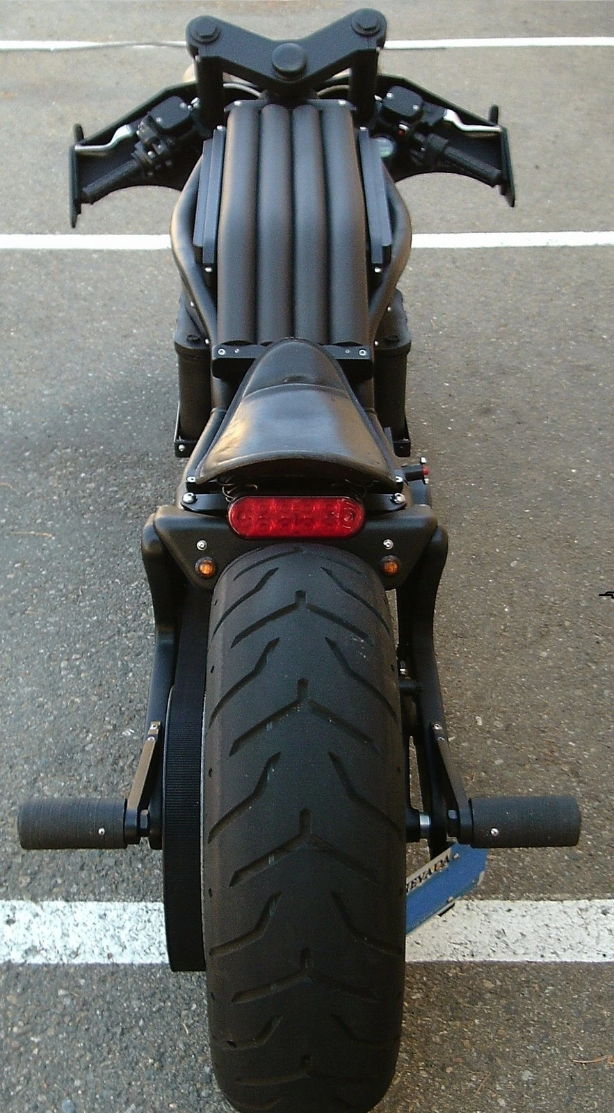 The batteries can be charged from a conventional outlet, and provide about 40 miles (64 km) of range as long as you're not riding the bike the way Batman would