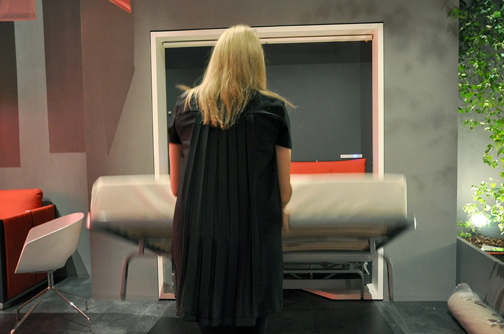 The beds simply pulls down with the metal support beams automatically opening up