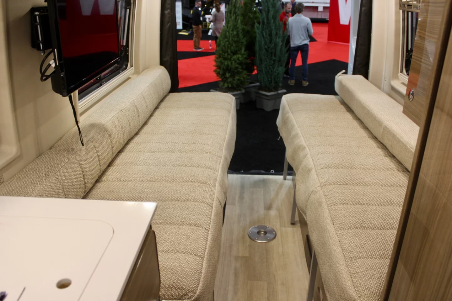 The versatile rear bed of the Q70 BL floor plan works as a pair of sofas, two twin beds or a single queen-size bed