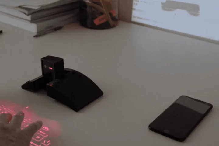 The Masterkey 4.0 projects a laser keyboard on the desk and a display on the wall