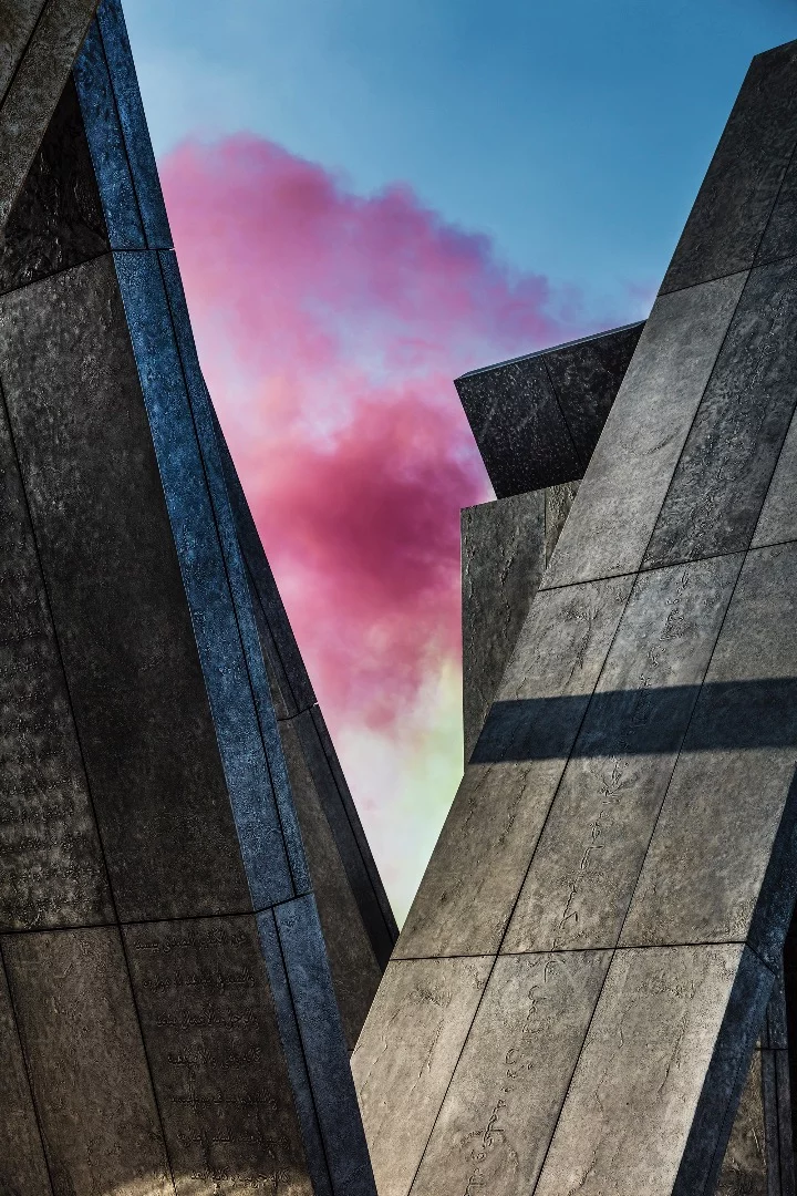 A smoke bomb is released behind the Wahat Al Karama memorial to heroes in Abu Dhabi. Designed by artist Idris Khan