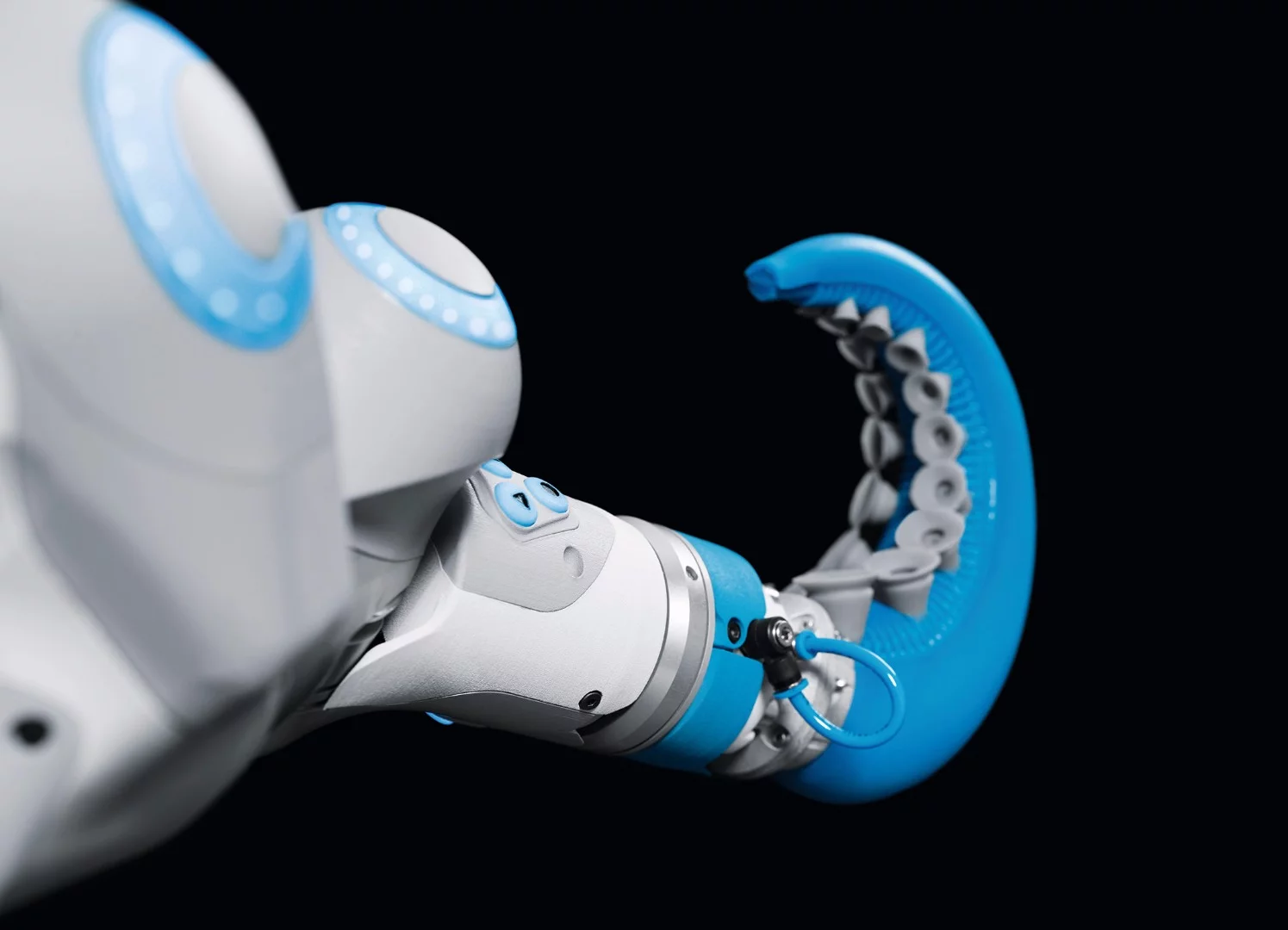 The tentacle of the OctopusGripper bends inwards to wrap around objects when compressed air is applied