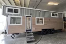 This tiny house, designed by Washington's Big Freedom Tiny Homes, has a length of 30 ft (9.14 m) and makes room for a small family