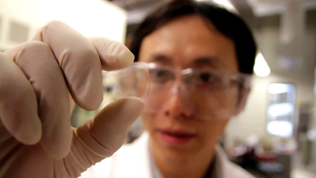 Postdoctoral researcher Yu Zhu with the graphene-based hybrid film on a flexible plastic substrate