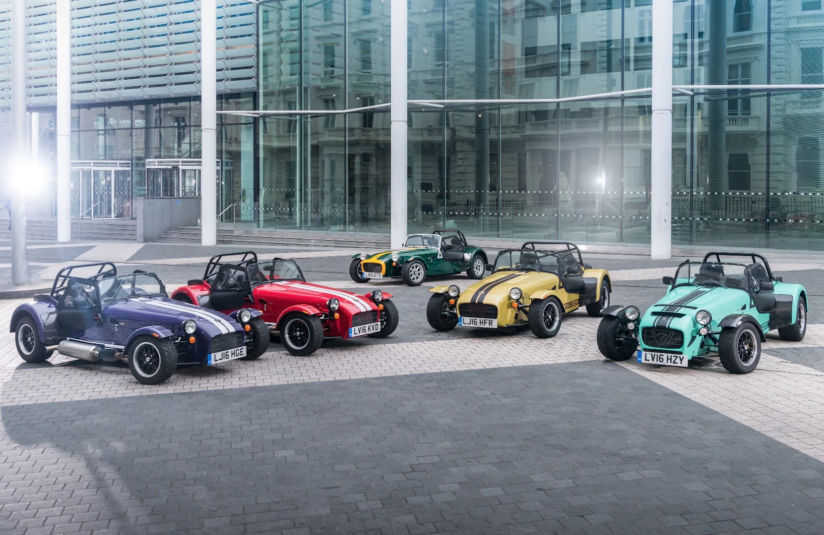 The entire Caterham family sitting side-by-side