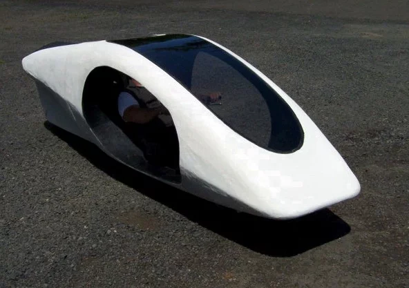 The Thrustcycle SRT is a three-wheeled vehicle that incorporates a gyro/flywheel system to maintain its balance, and harvest power from braking