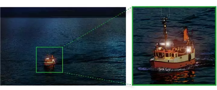 A thumbnail-sized photo of a boat on a lake with lights on is the best sample image Canon has deigned to provide at this stage
