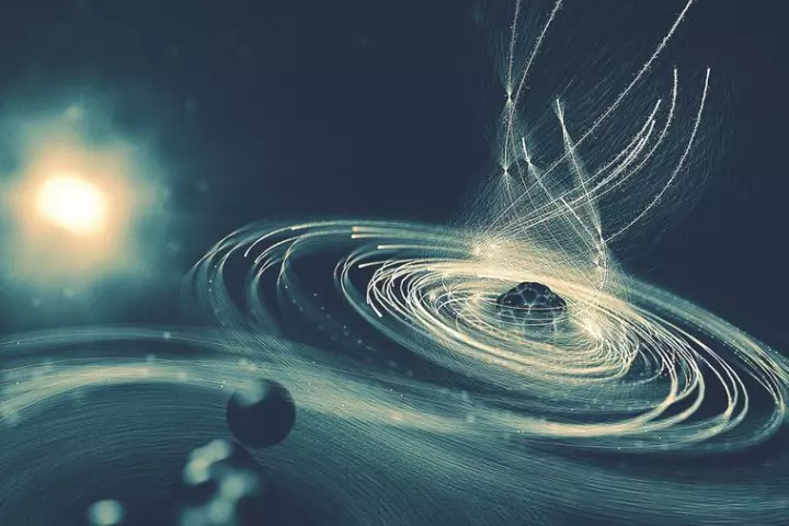 In this illustration, a molecule's iodine atom is struck by an intense x-ray beam, causing it to lose electrons and begin sucking in more from the atoms around it, in what the team calls a molecular black hole effect