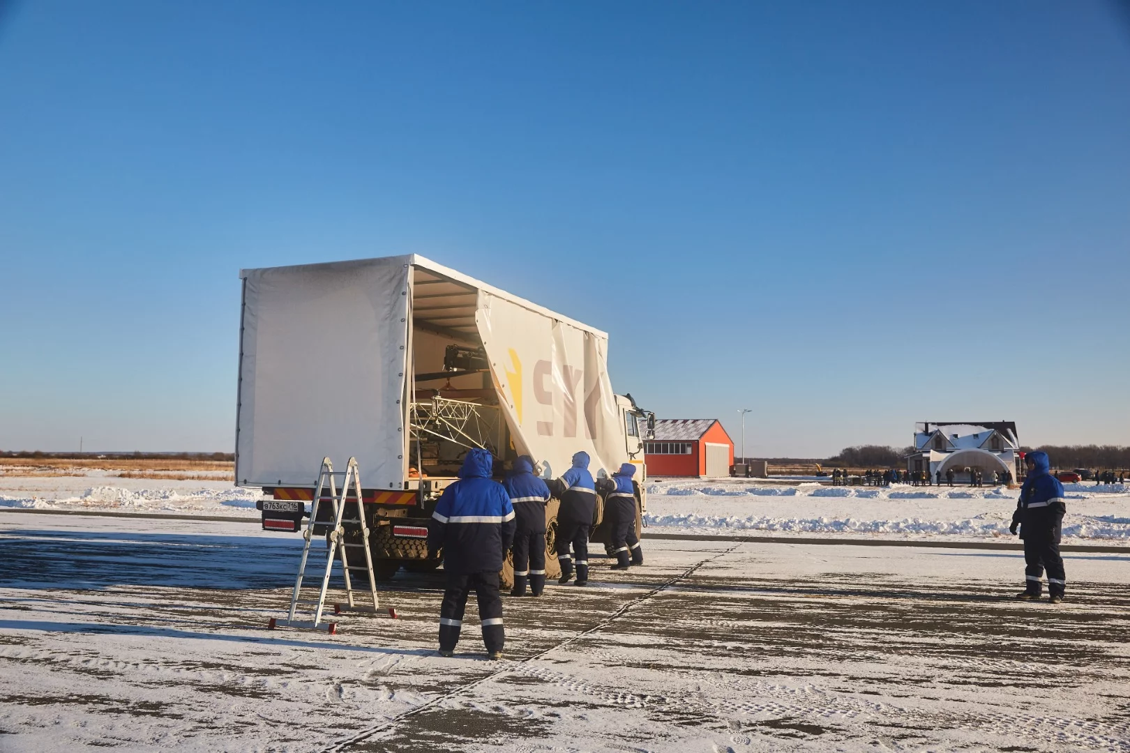 Workers prepare the Skyf drone for demonstration