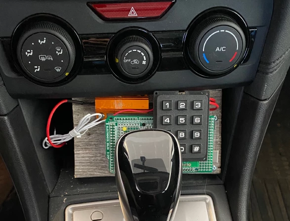 You could also use a keypad or fingerprint reader plugged into the cigarette lighter socket to generate a signature voltage fluctuation... But why would you?