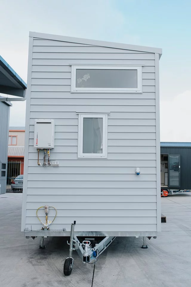 The Dance Tiny House is clad in vinyl siding