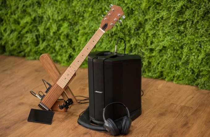 The Cross Guitar 2.0 has a piezo pickup and onboard headphone amp