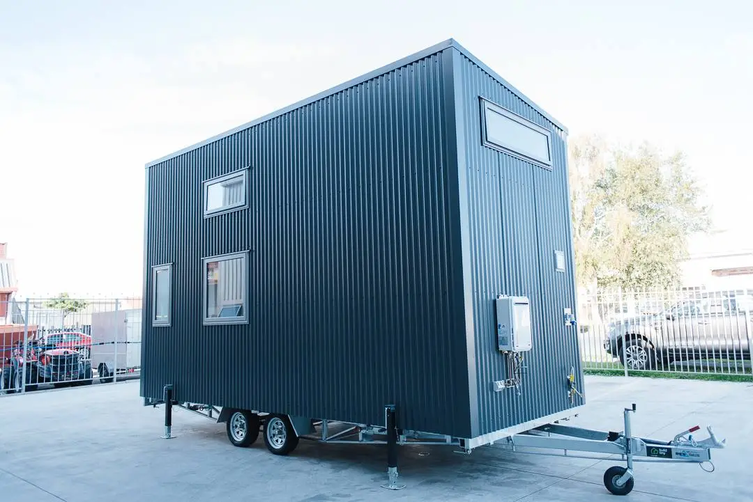 The Larissa and Tyler Tiny House has a cedar and steel exterior