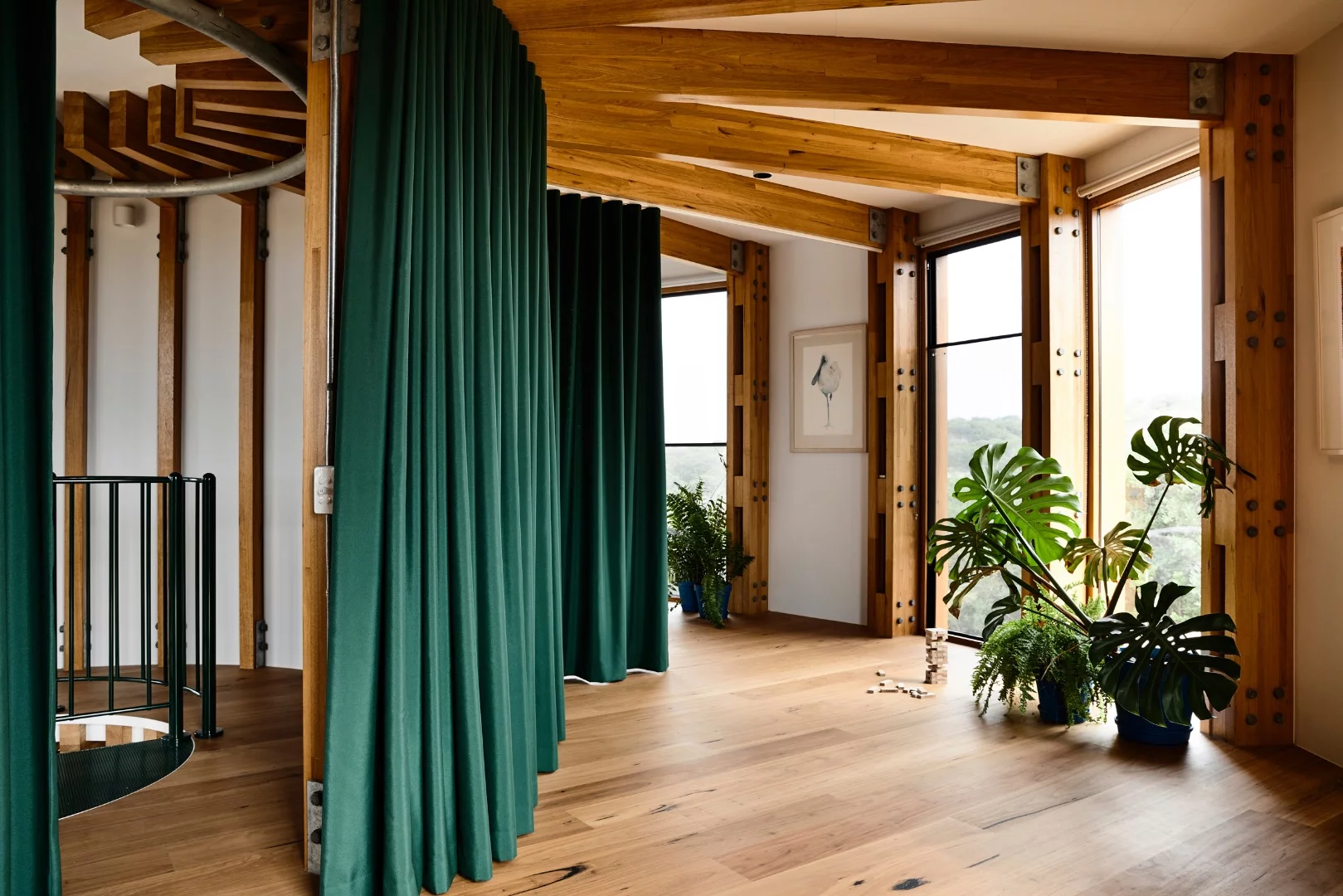 St Andrews Beach House's upstairs consists of bedrooms that are divided by curtains