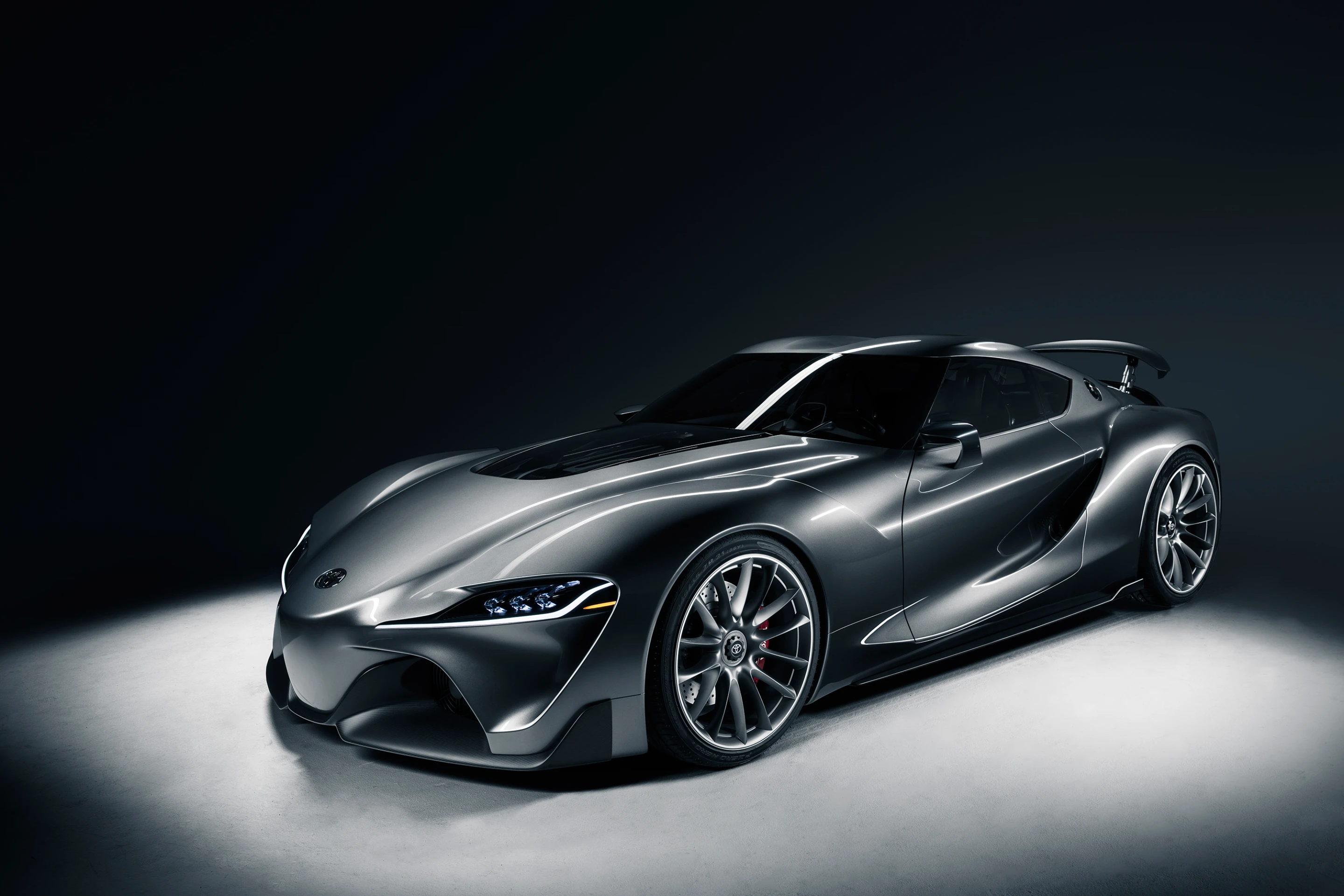 The new FT-1 shares its sculpted intakes and outlets with the original red concept
