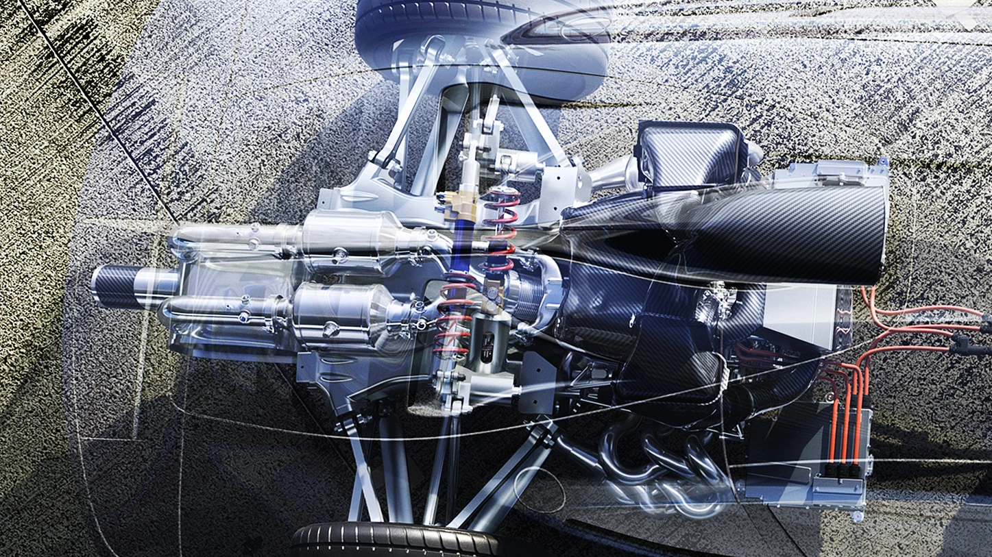 The 1600cc V6 petrol engine produces over 380kW (510 hp), with an electric motor mounted on the driveshaft adding another 120kW (161 hp) to the rear wheels. A 120kW (161 hp) electric motor drives each front wheel and the front axle features a torque vectoring function. All told, the internal combustion engine and electric motors deliver a combined output exceeding 740kW (992 hp) driving through a hydraulically operated eight-speed automated gearbox that can be driven as an automatic or manual shift