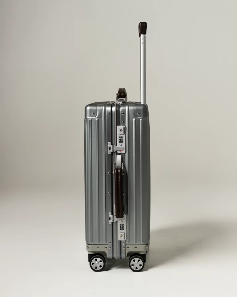 The tough titanium shell comes with luxury leather handles for comfort