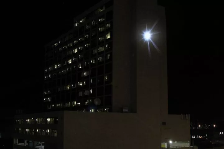 Adam Frank's SUNLIGHT at its peak, on the side of Denver's Minoru Yasui Building