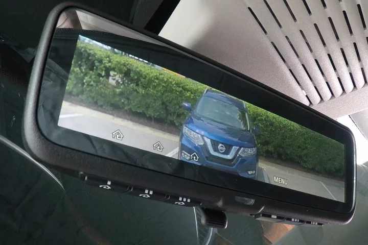 Nissan's intelligent mirror works by allowing the driver to switch between a standard, glass mirror and a view from the camera mounted on the back of the SUV