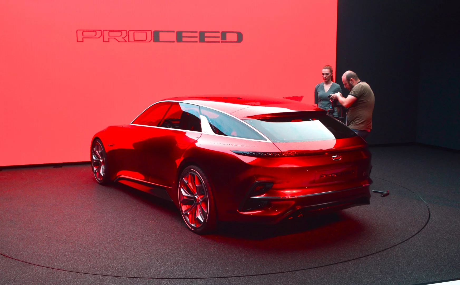 The rear-end design includes stacked vents and a wraparound lighting strip