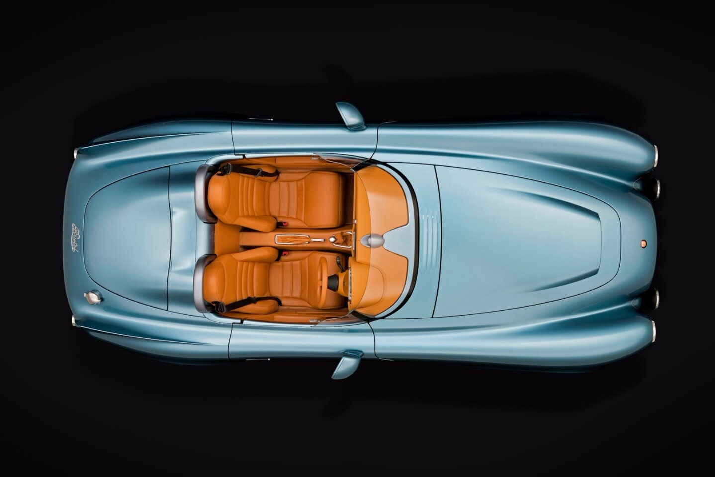 The car has a thickset form reminiscent of the recent Rolls Royce models, but it is pulled together with more graceful and refined curves