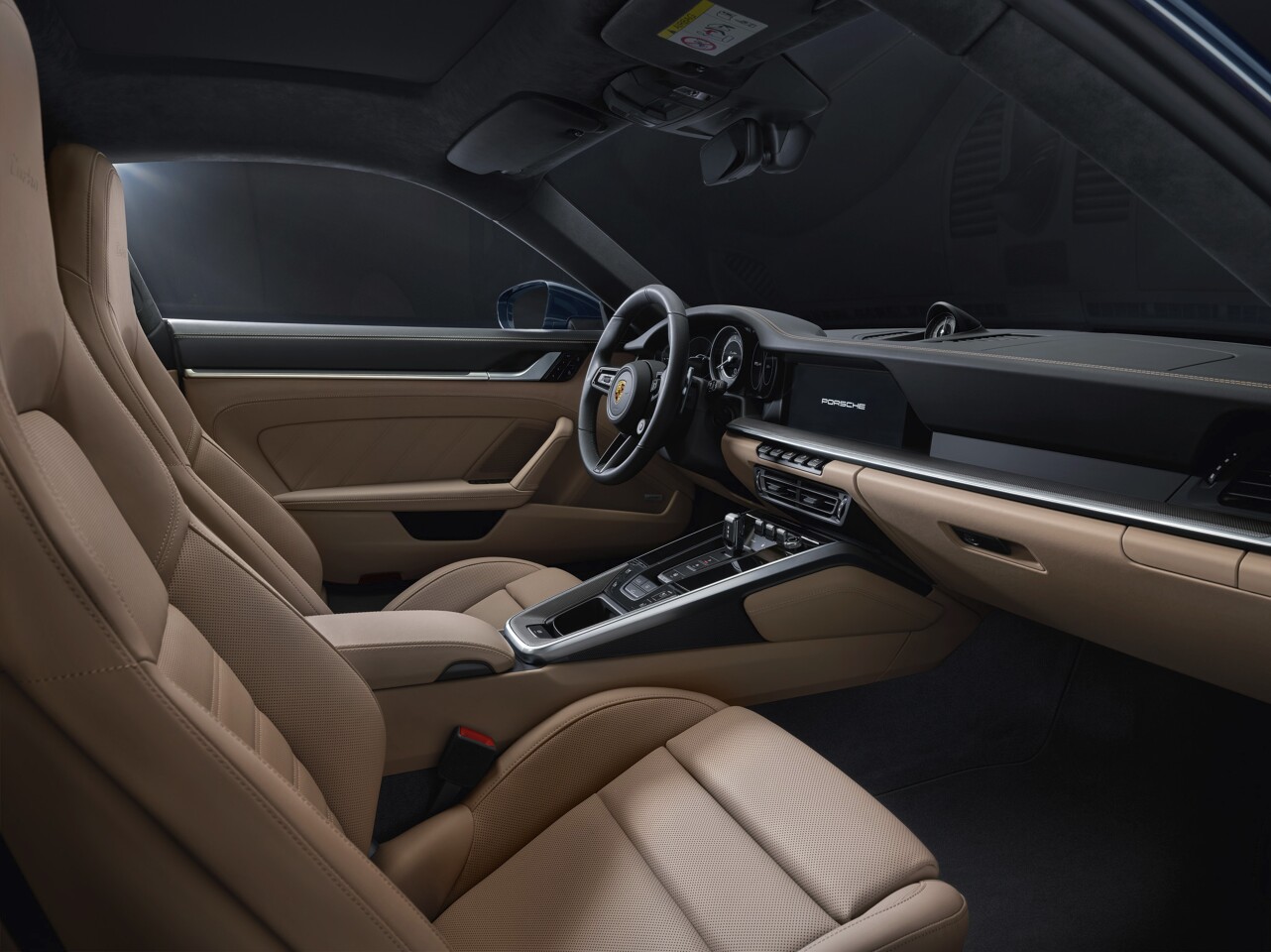 The interior includes a sport steering wheel and sport seats