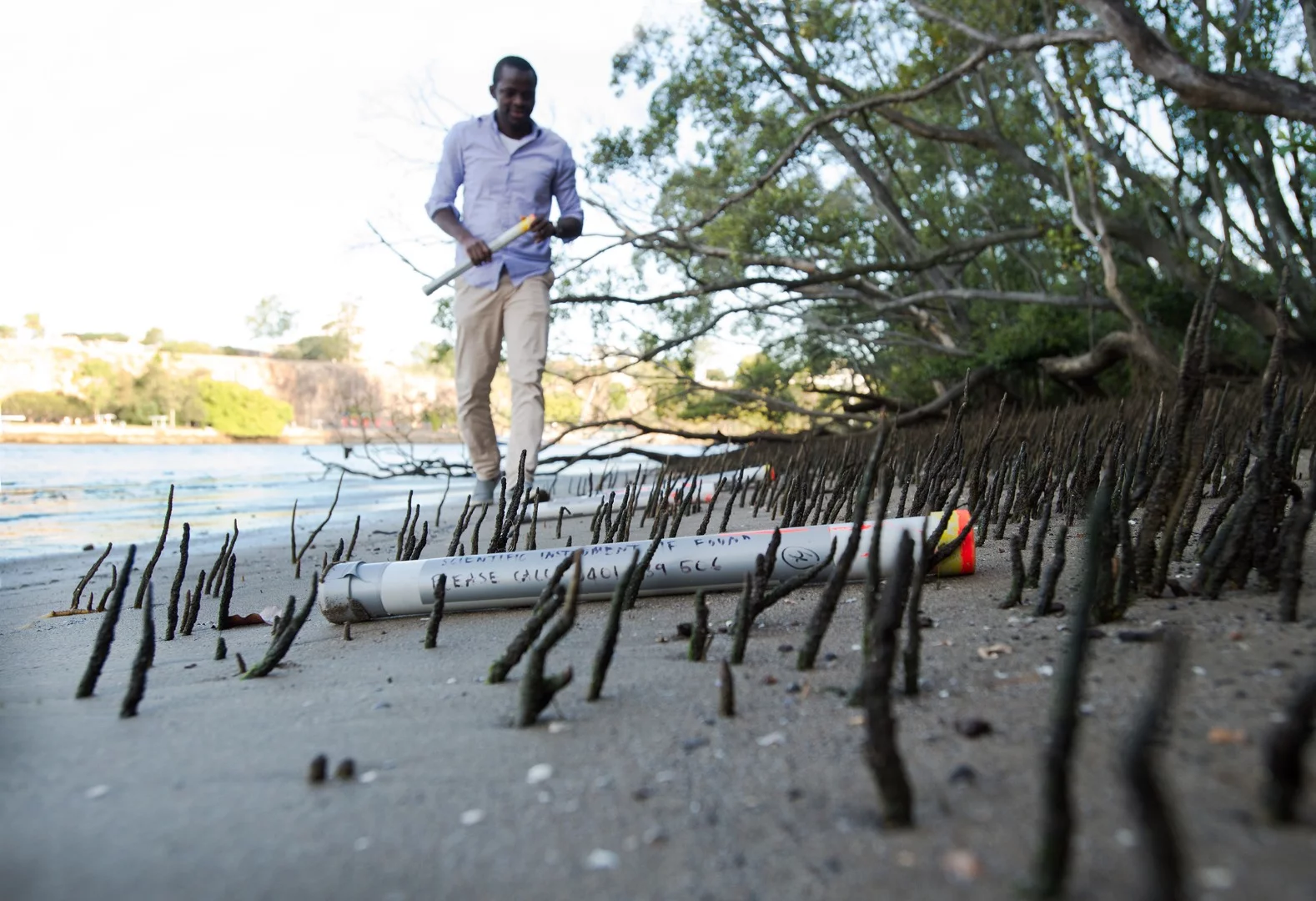 QUT researcher Dr Kabir Suara collects one of the Drifter devices
