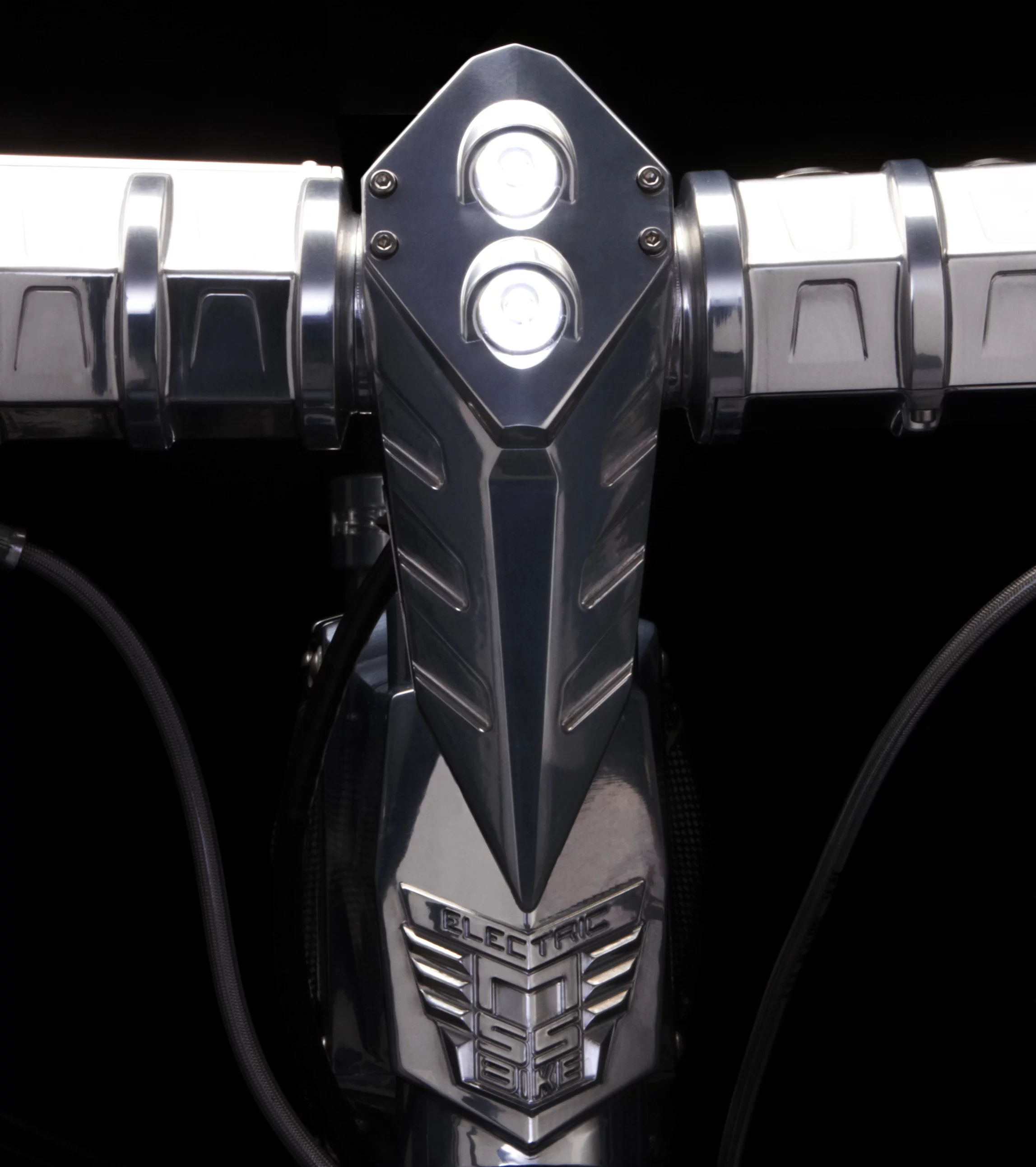 The handlebar and stem features a built-in LED headlight