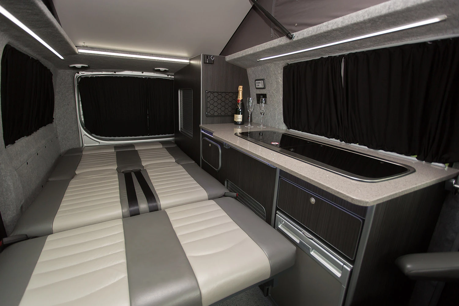 The rear seats fold down electrically to create the cabin bed