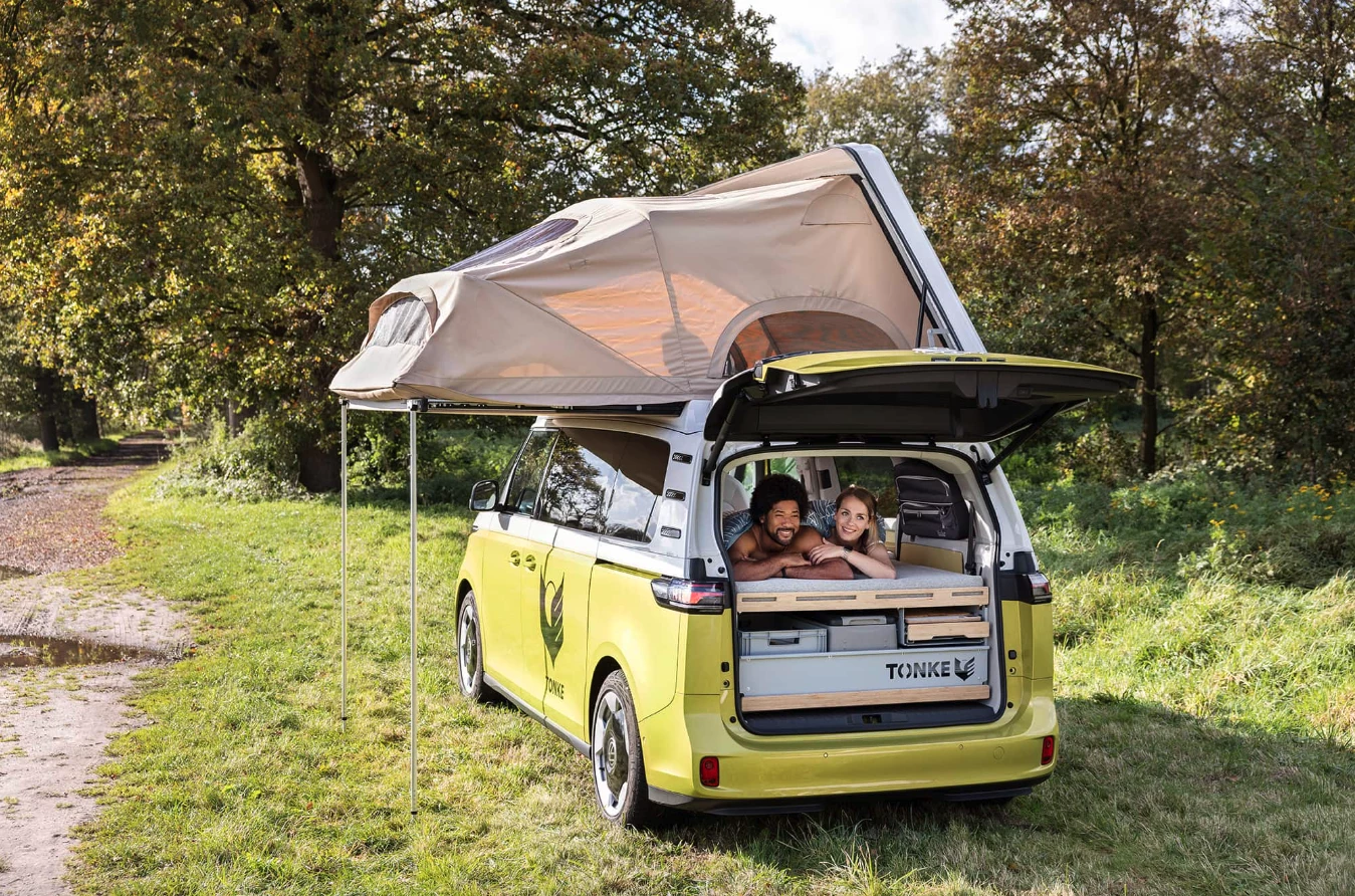 Instead of the forward/rearward tilting action of the typical pop-up roof, Tonke's pop-top tilts sideways and extends outward, adding more upstairs sleeping space with a rooftop tent-style design