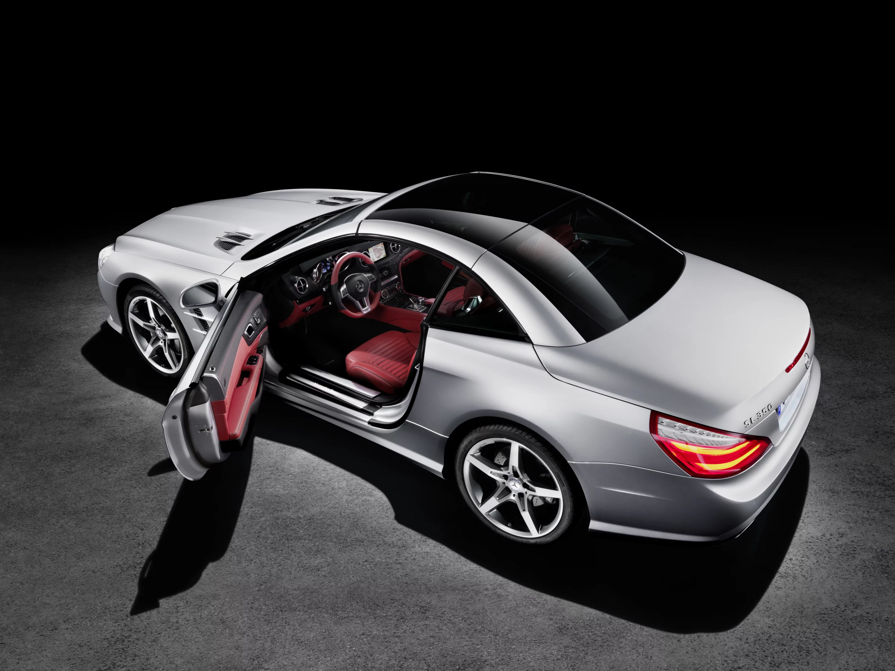 The 2013 SL class features a retractable hard top with a glass panel that changes from dark to transparent at the touch of a button