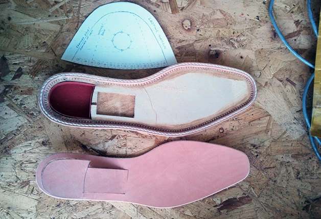 The soles of the bespoke shoes features an illustration etched-on
