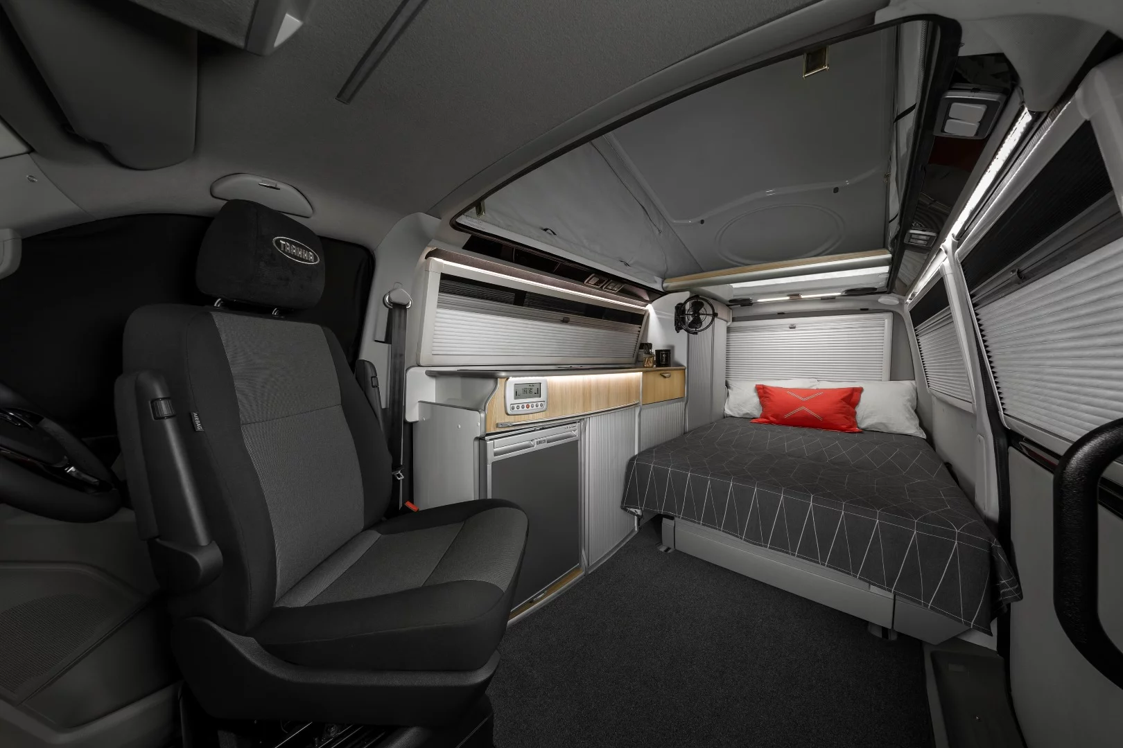 Bed folded out and blinds closed for the night