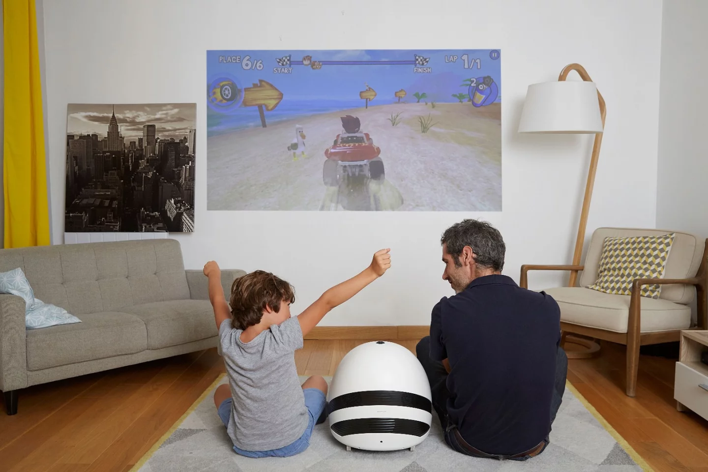 The roughly egg-shaped Keecker has an LED projection unit to the front that throws out a 78-inch, 720p image